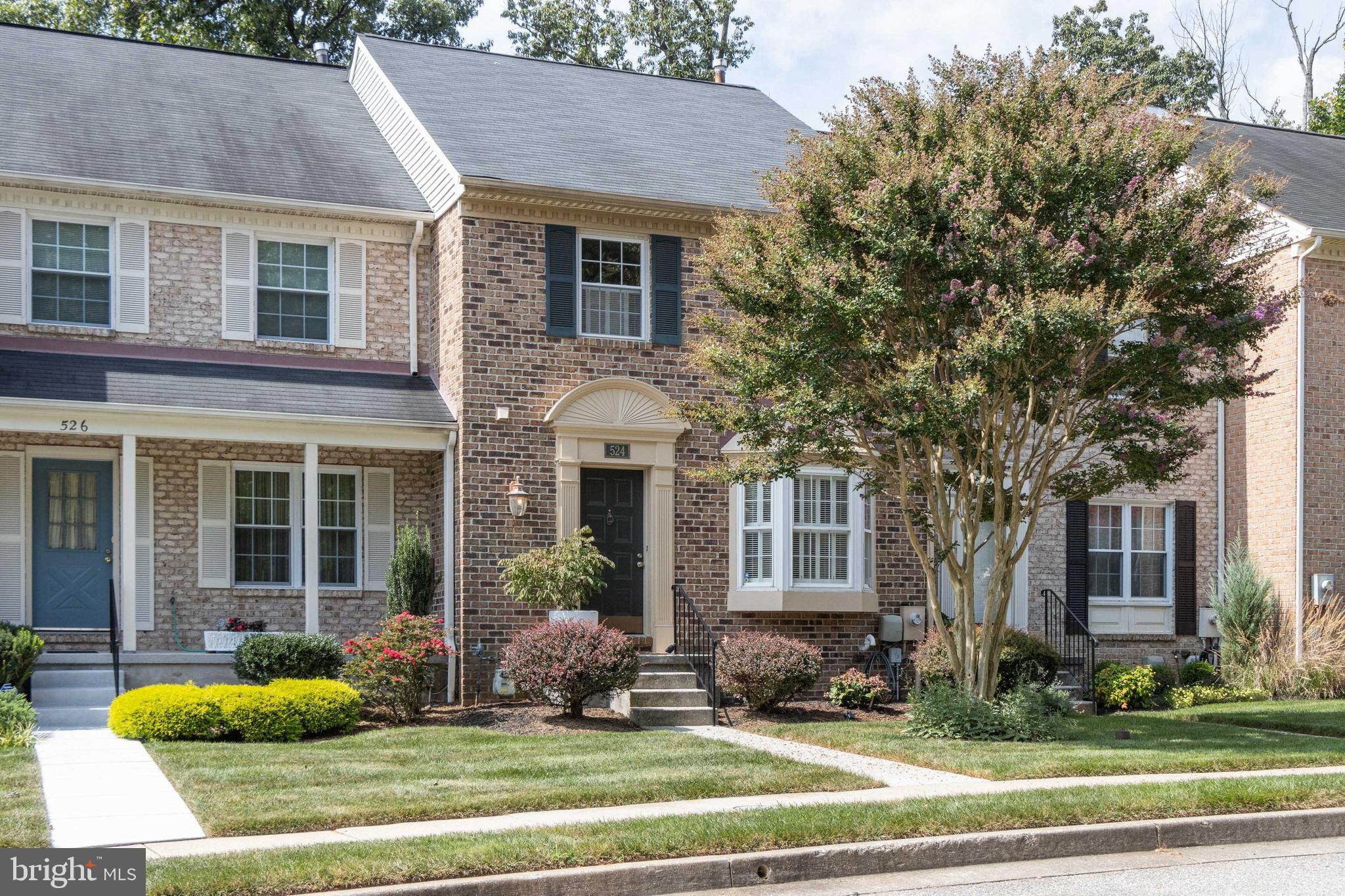 a front view of a house with yard outdoor seating and yard