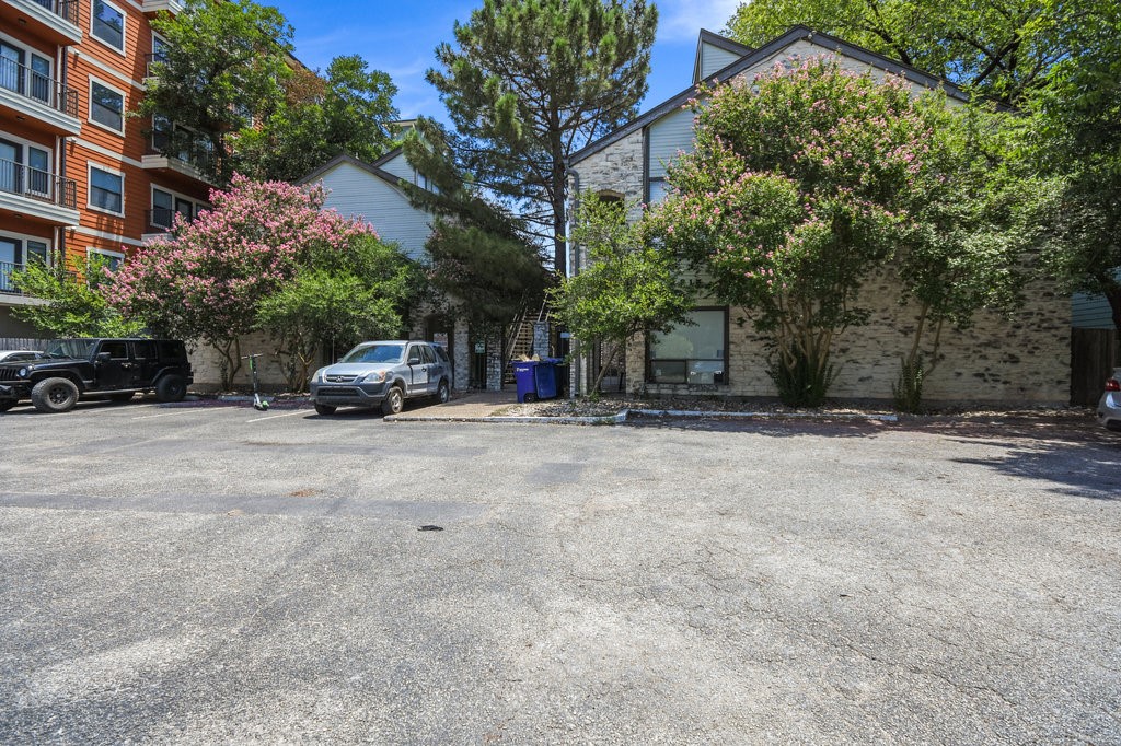 a view of a car parked in front of a building