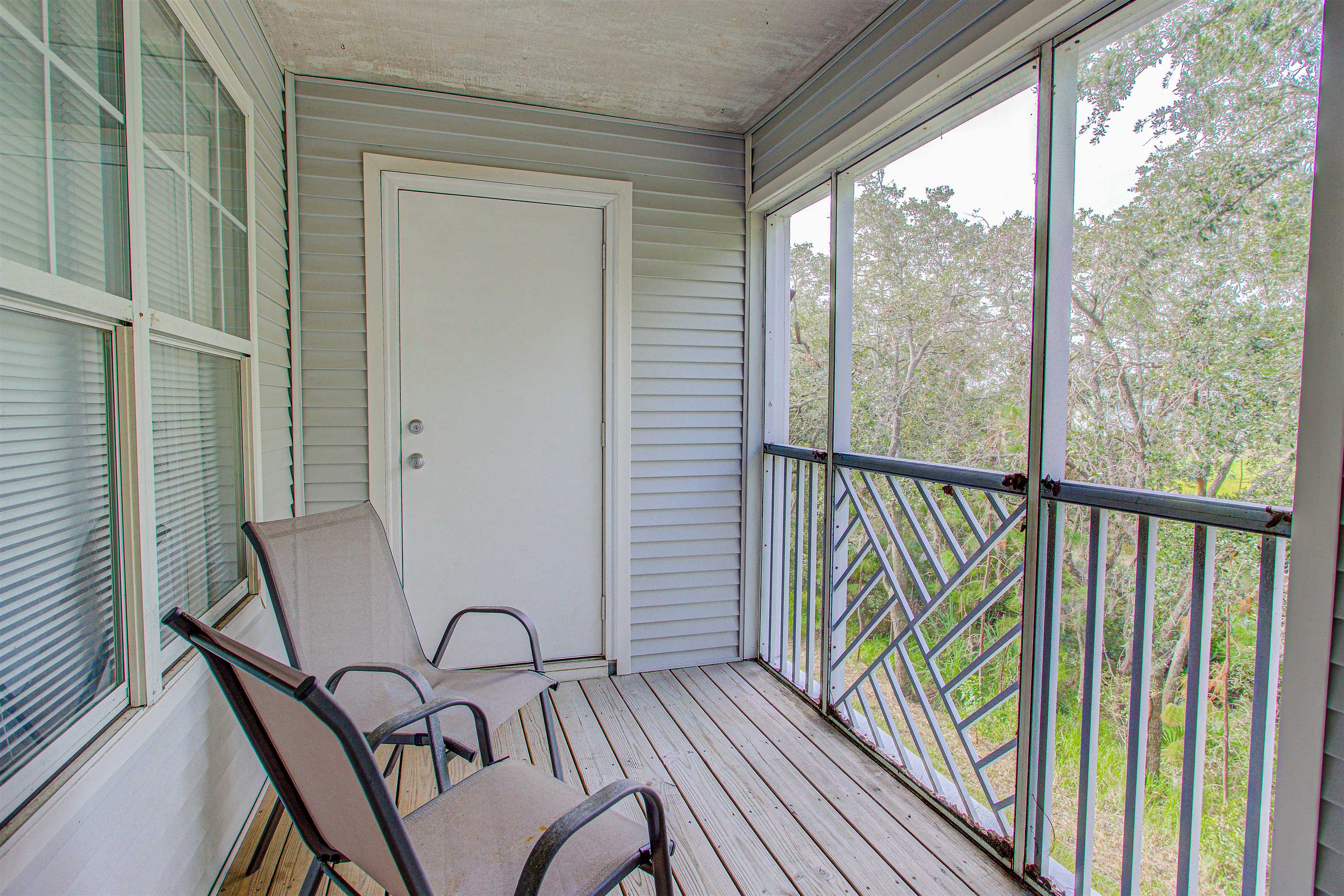 a view of a balcony with furniture