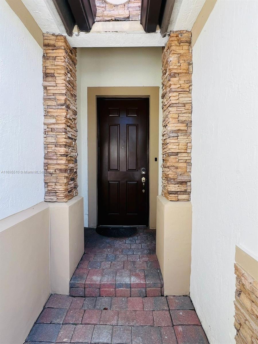 a view of a entryway door of the house