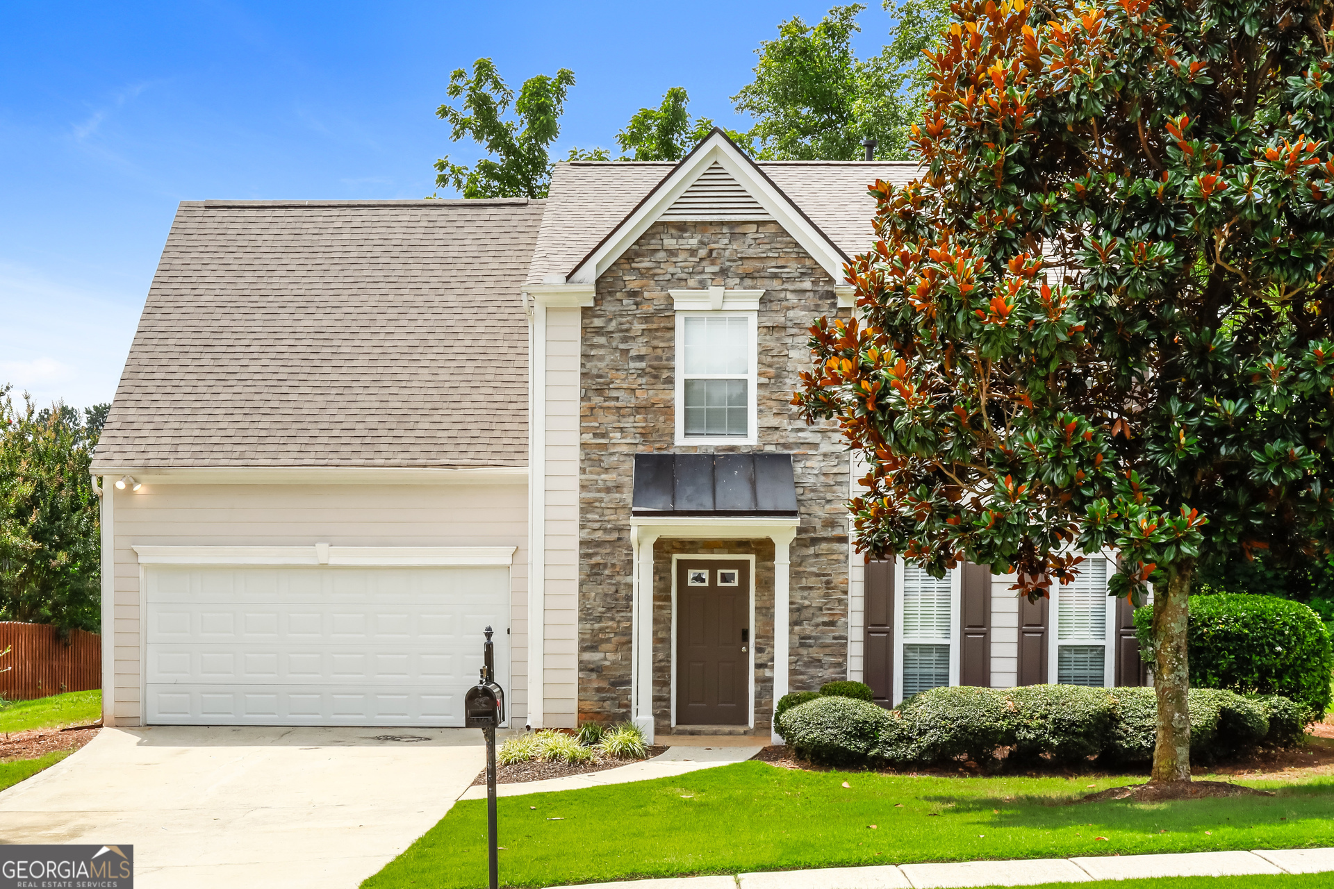 a front view of a house with a yard