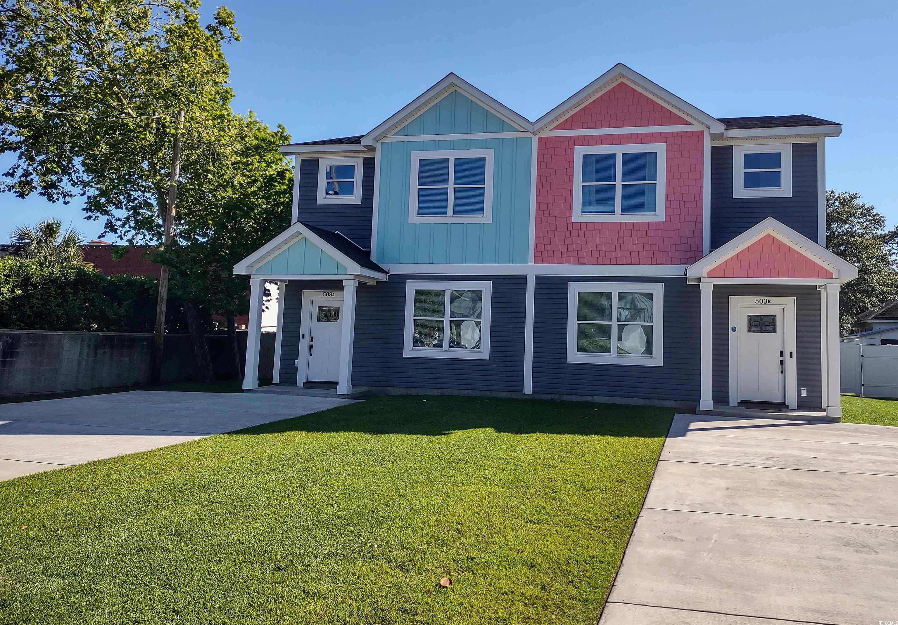 View of front of property with a front yard