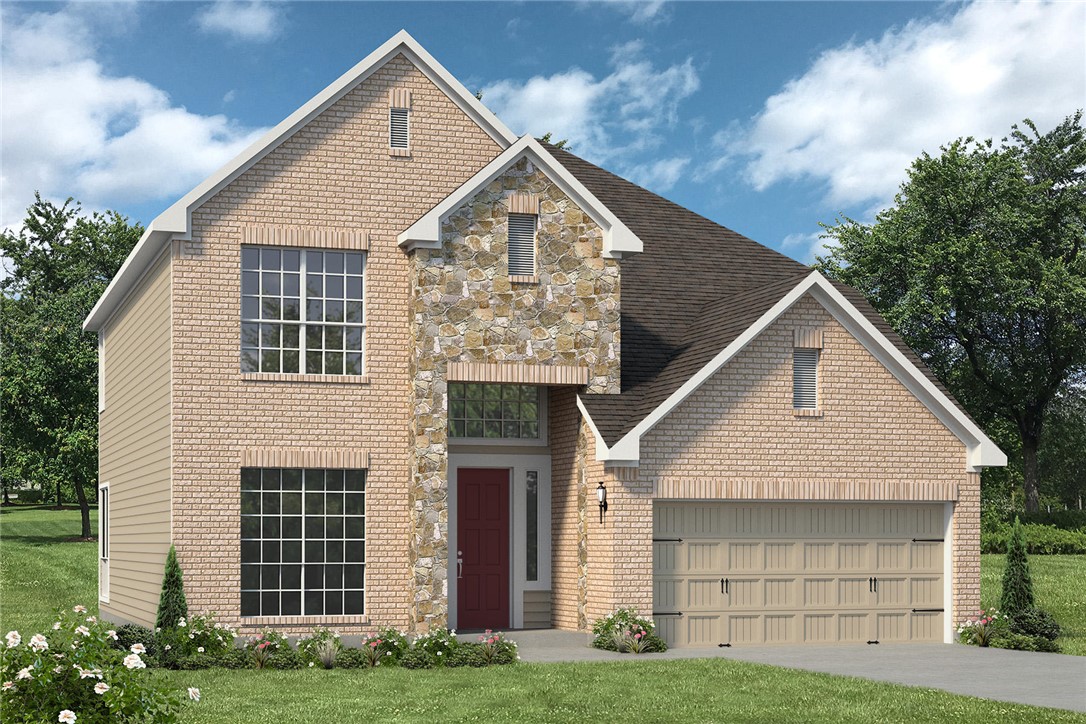 Front facade featuring a front yard and a garage