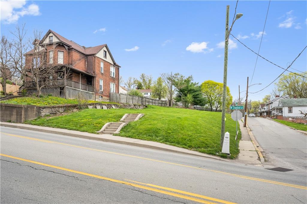 a view of a house next to a yard