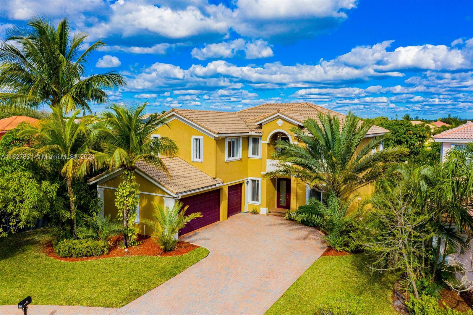 a view of a house with a big yard