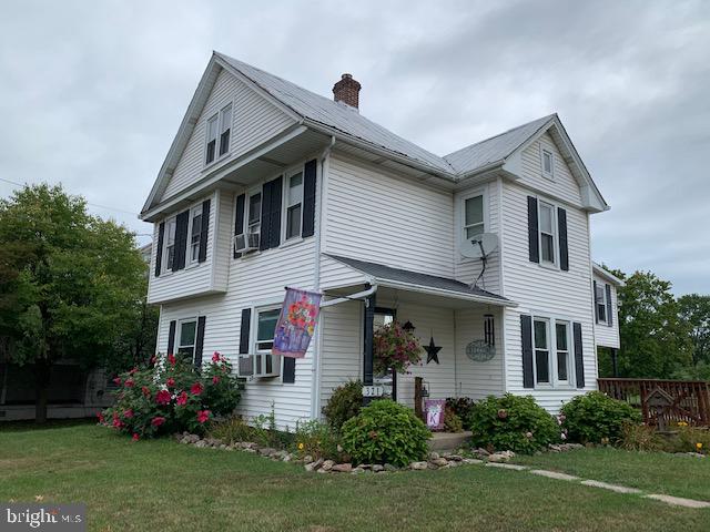 a front view of house with yard