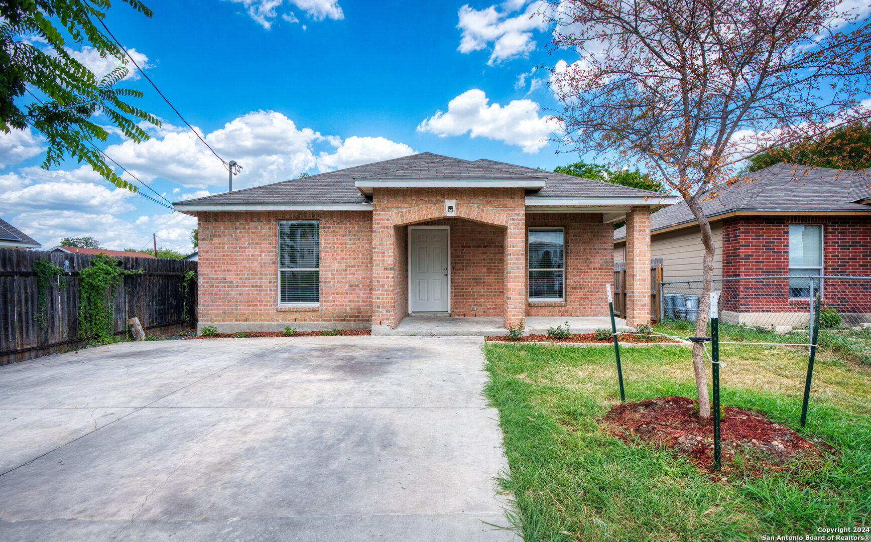 a front view of a house with a yard