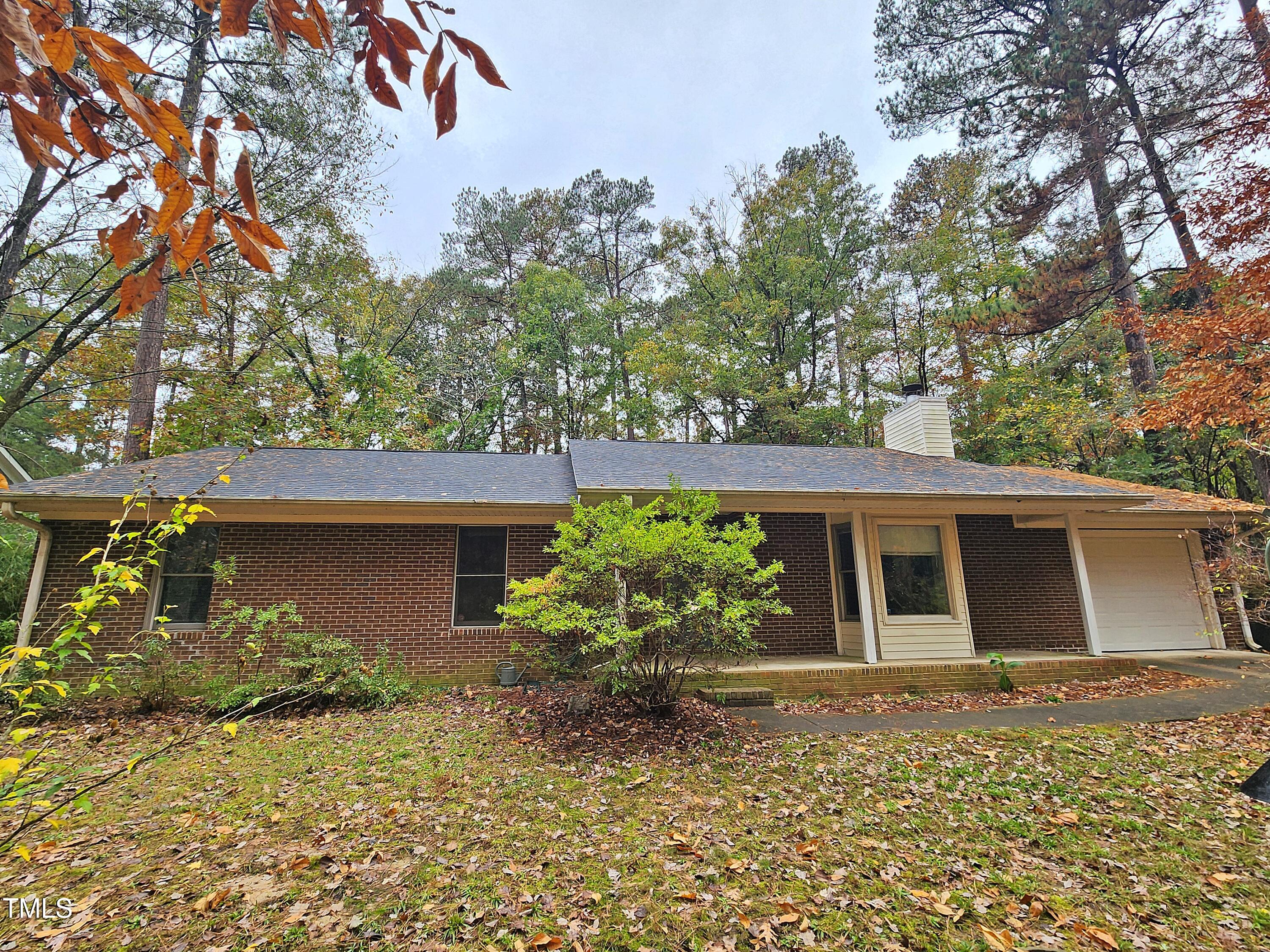 a house with trees in front of it