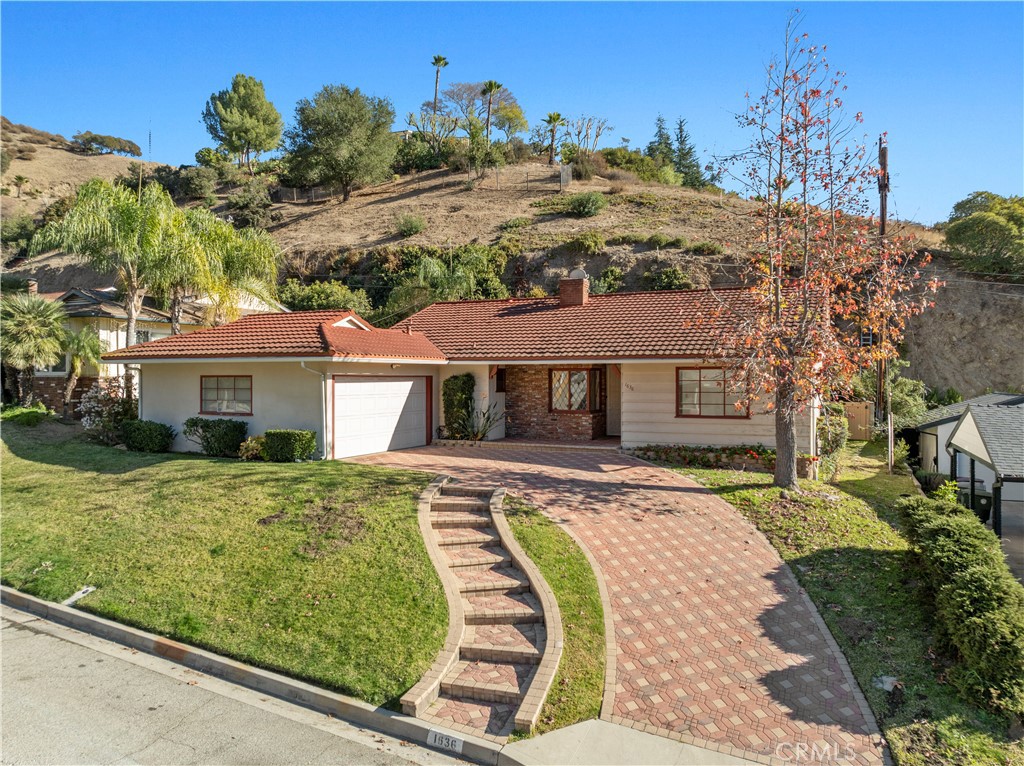 a view of a house with a big yard