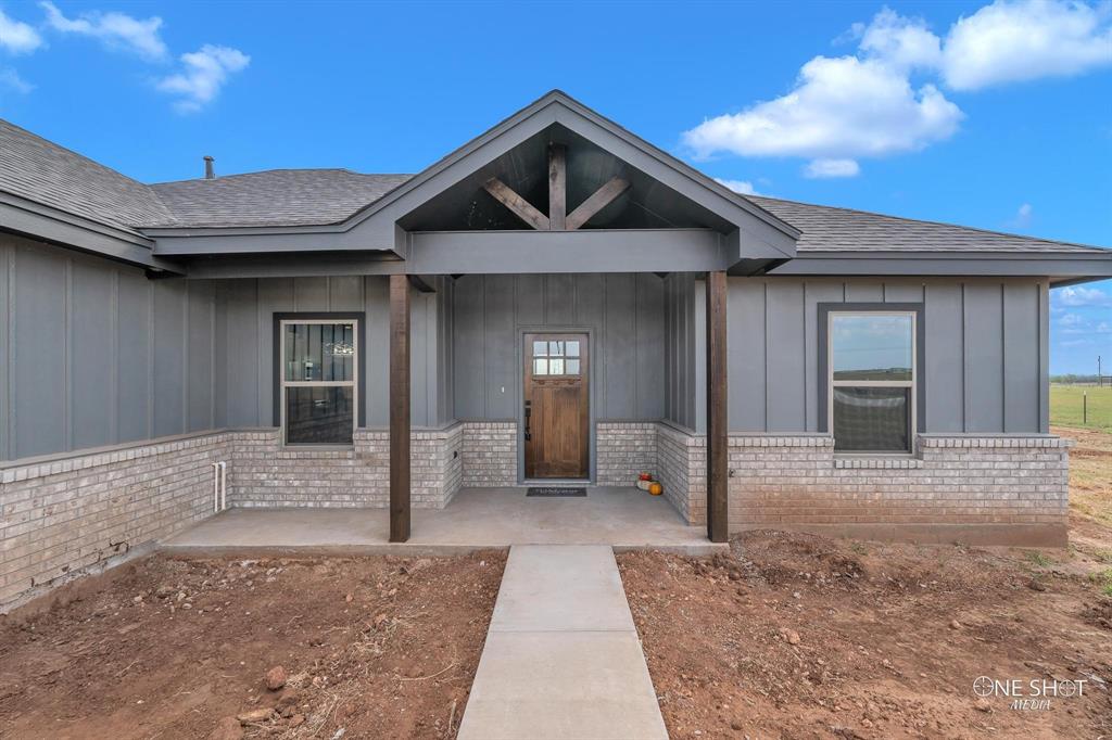 a front view of a house with yard