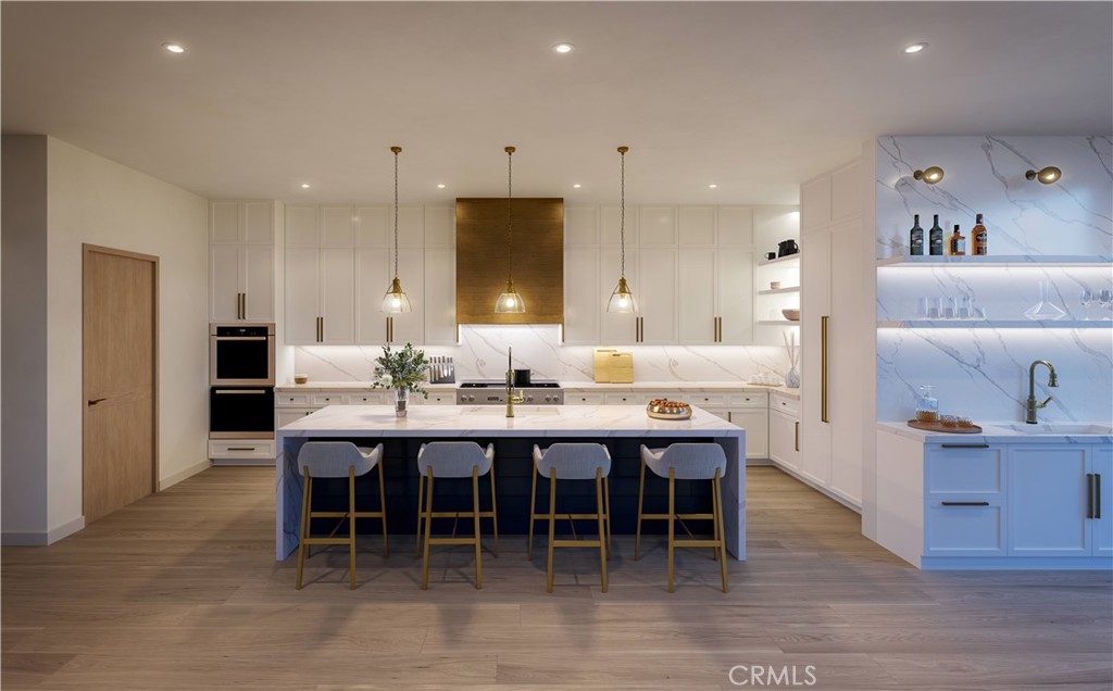 a large kitchen with a table and chairs