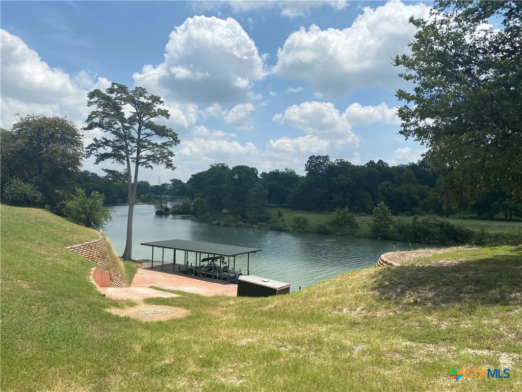 a view of a lake with a yard