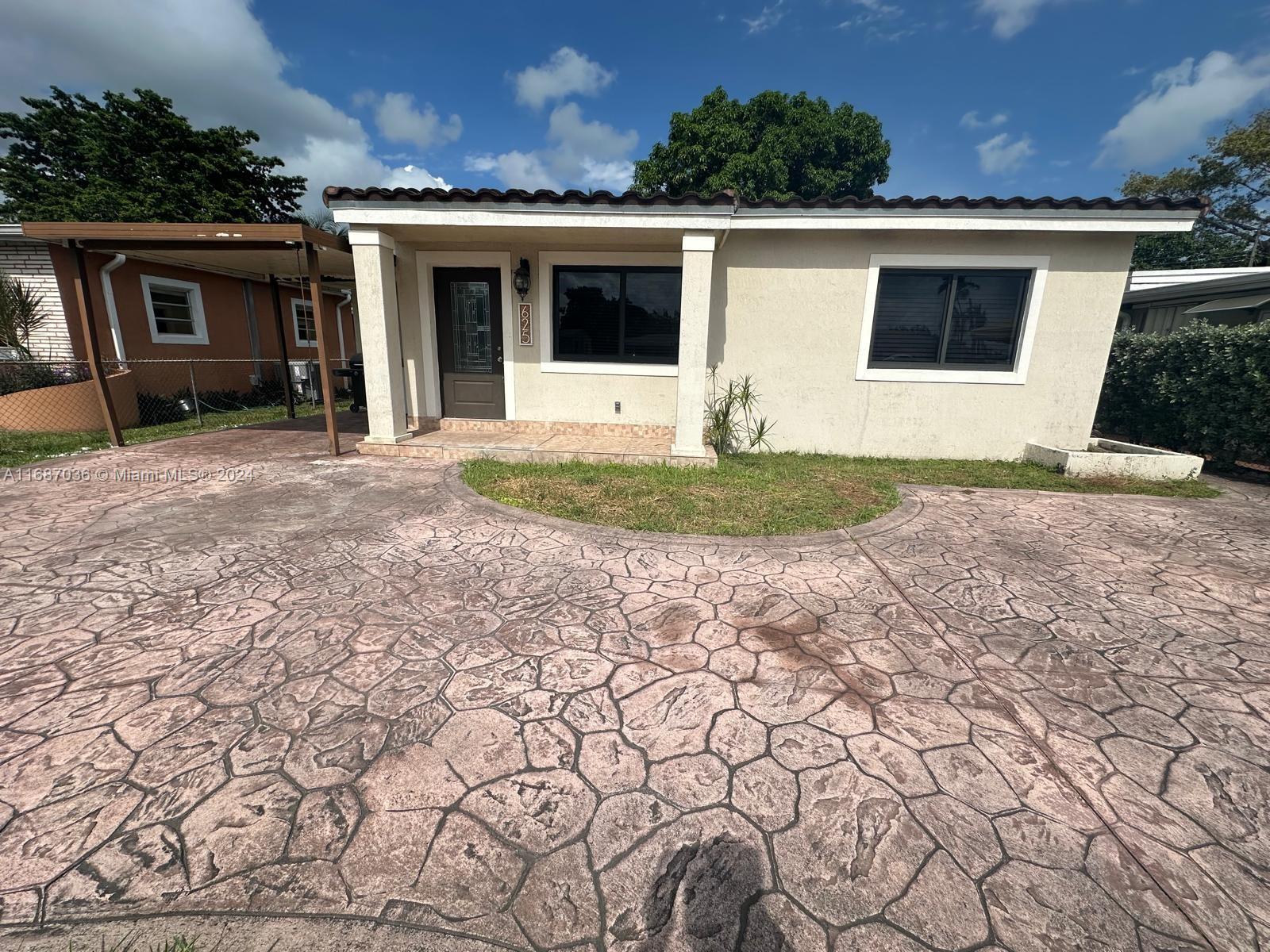 a view of a backyard of the house