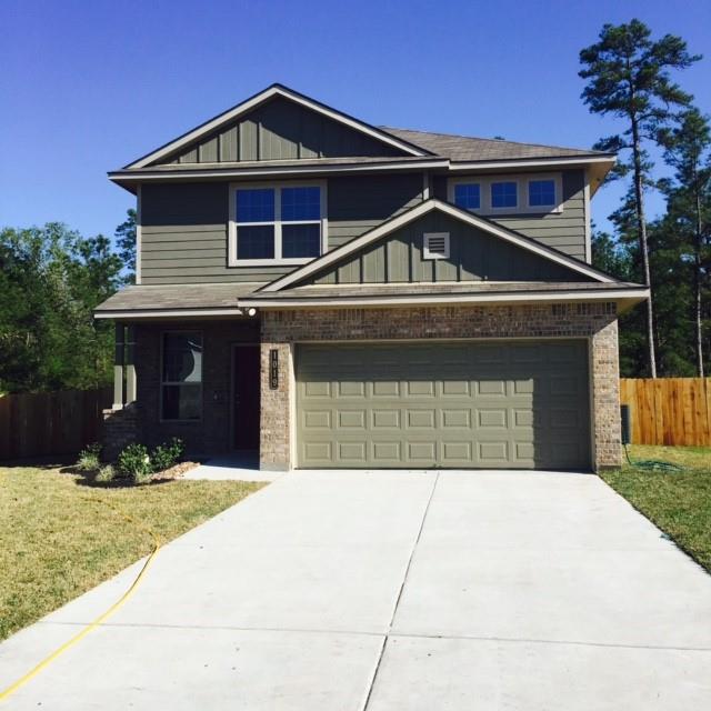 a front view of a house with yard