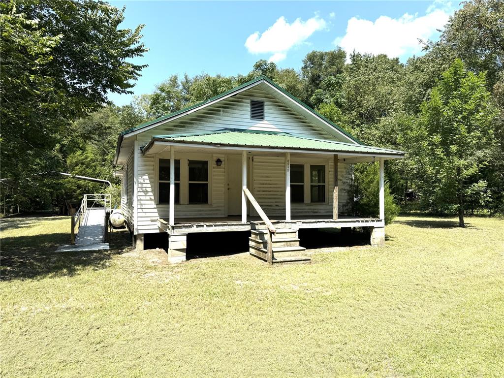 a front view of a house with a yard patio and fire pit