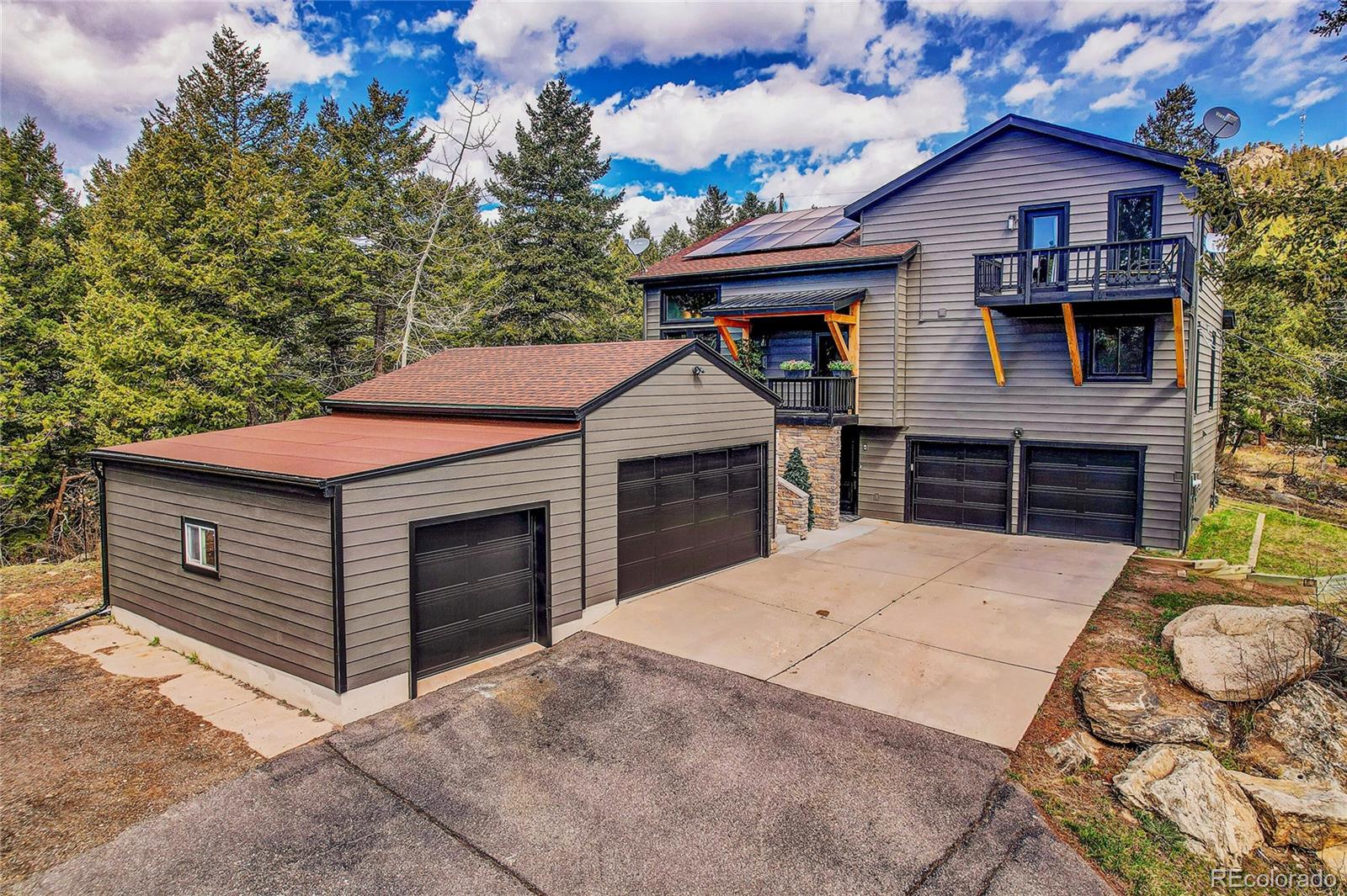 a front view of a house with a garage