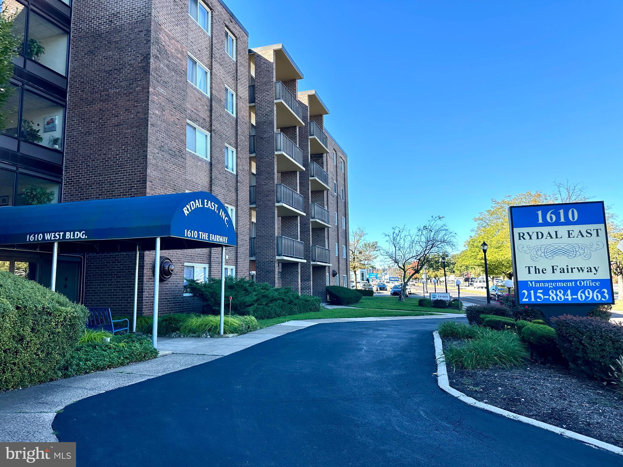 a view of a building with a yard