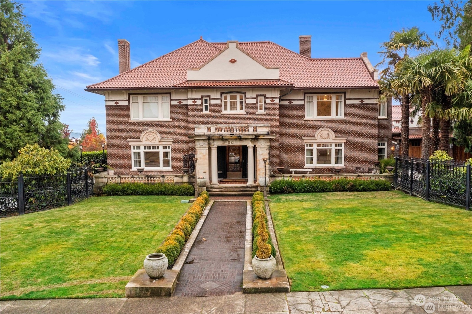 a front view of a house with garden