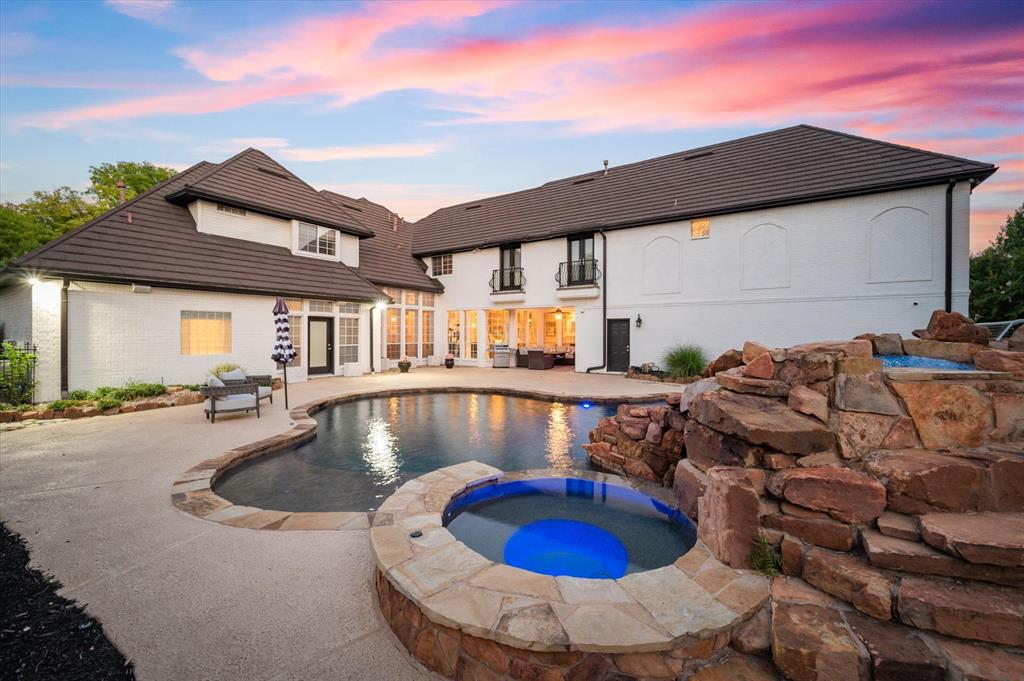 a view of swimming pool with outdoor seating