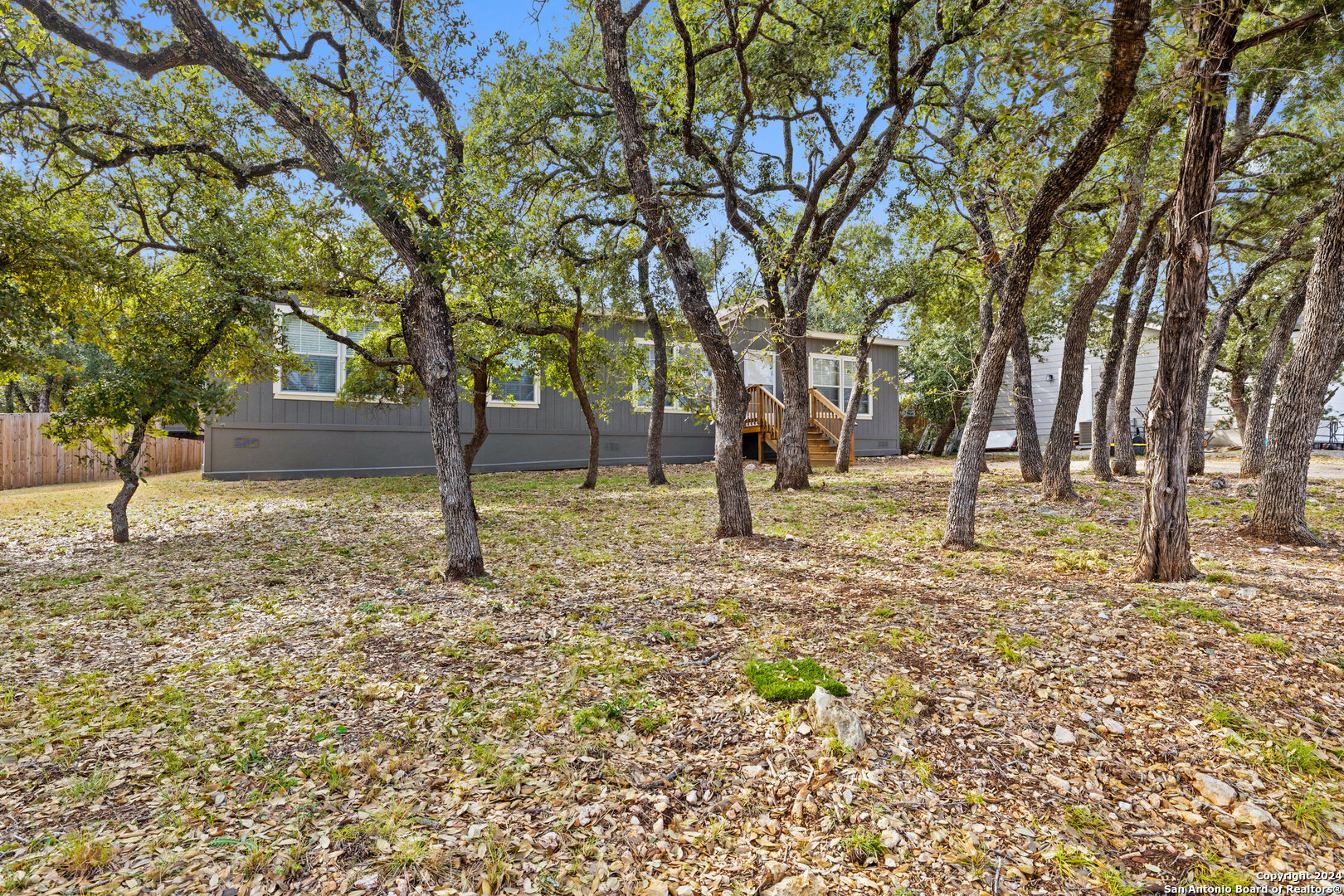 a backyard of a house with lots of green space