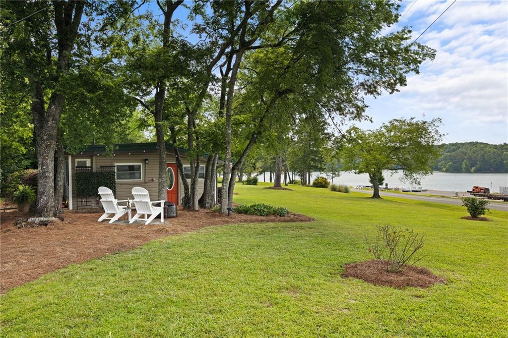 a backyard of a house with table and chairs