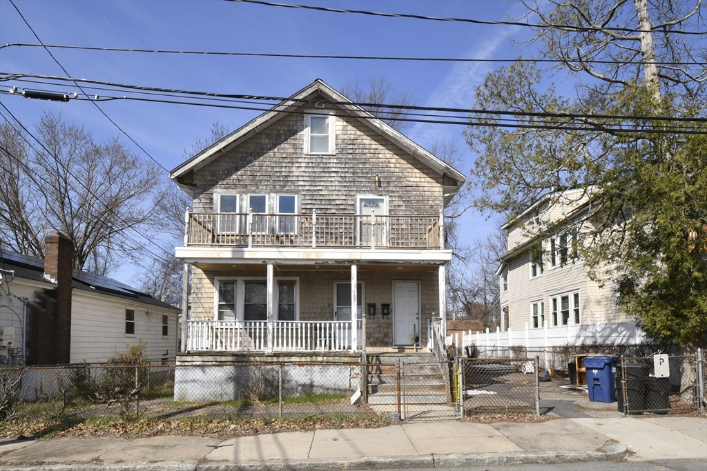 a front view of a house with a porch