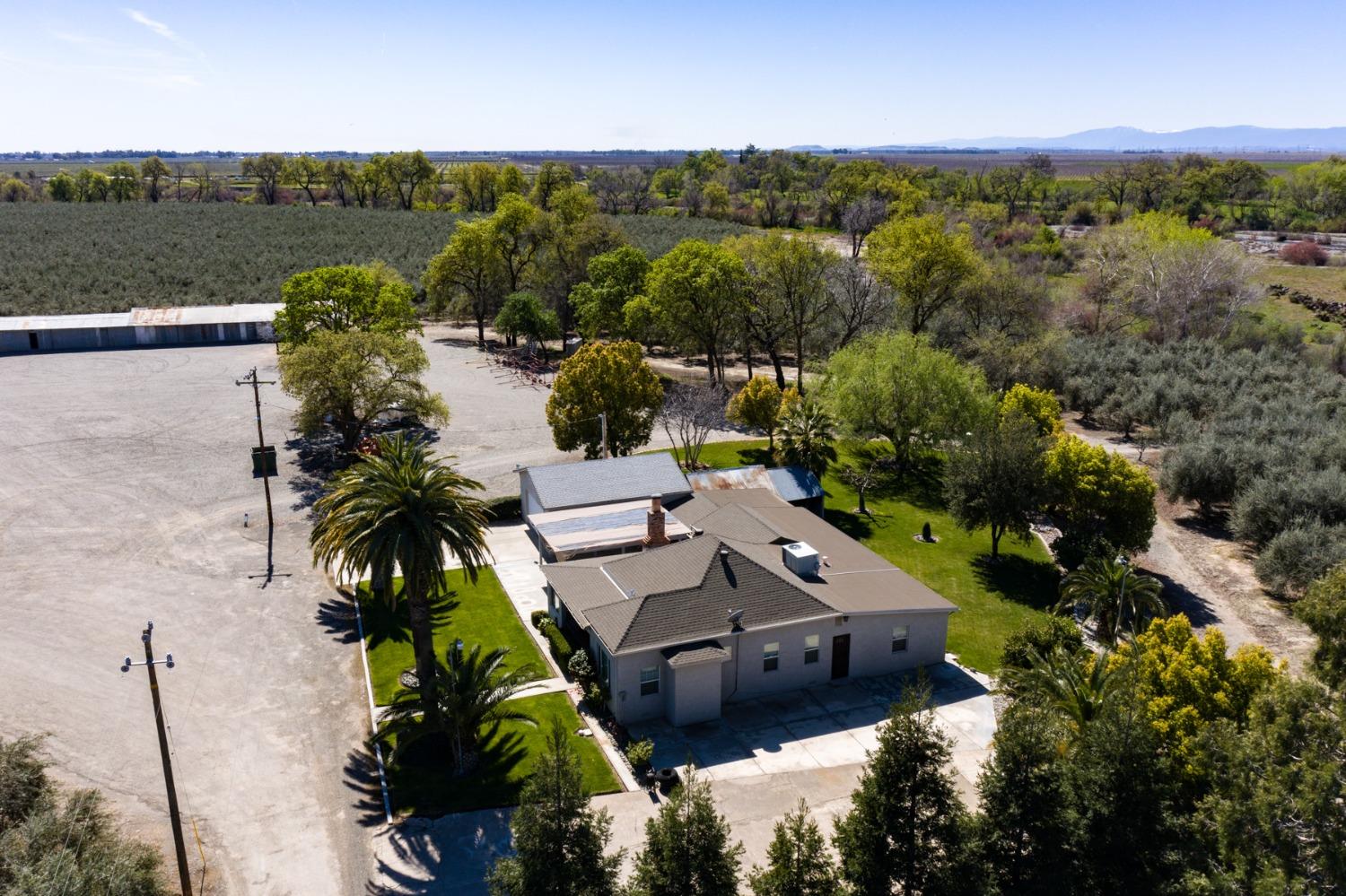 an aerial view of a house with a lake view