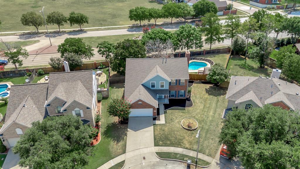 an aerial view of house with yard swimming pool and outdoor seating