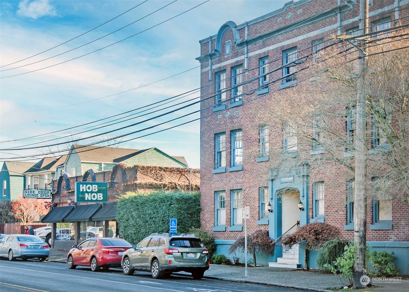 a front view of a building with parking space