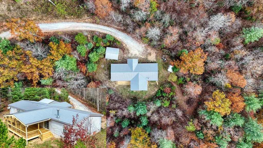 an aerial view of a house with a yard and garden