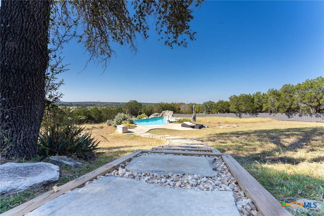 a view of a yard with an outdoor space