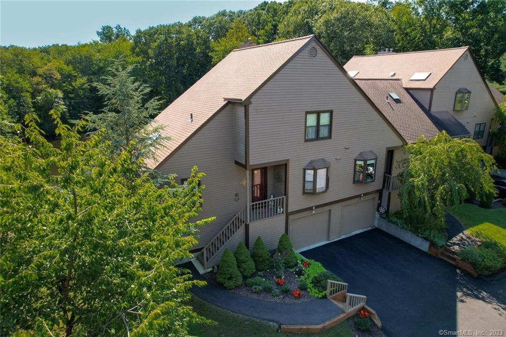 a aerial view of a house with a yard and a garden