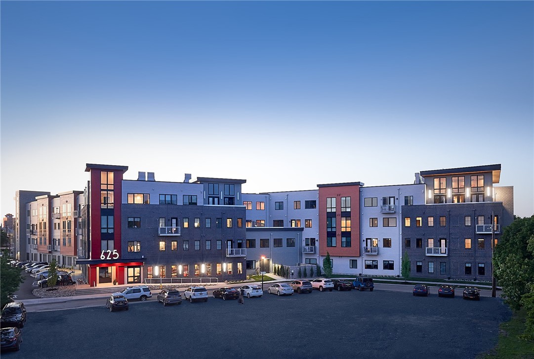 Wider view of 625 S. Goodman Apartments exterior