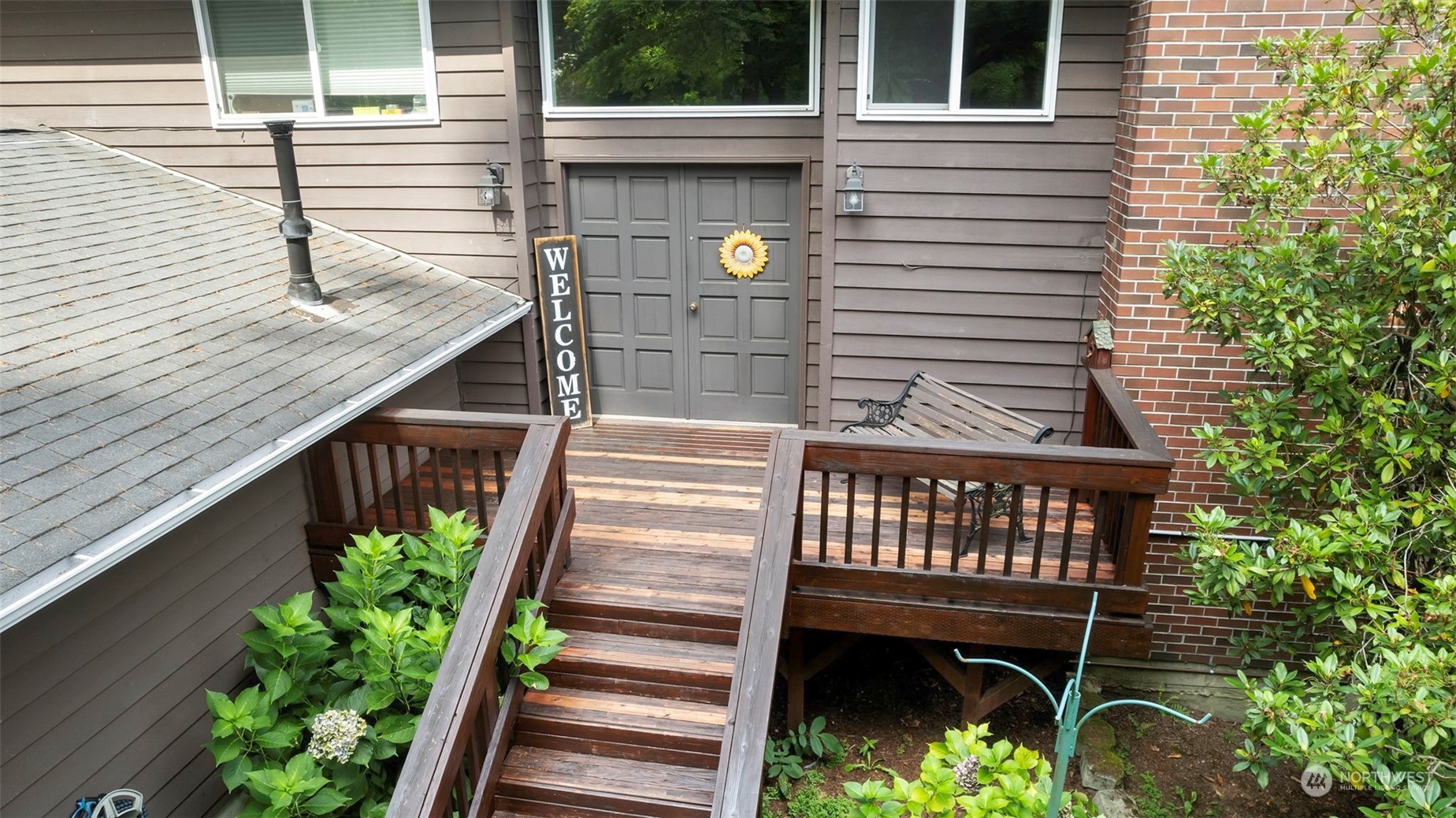 a view of a wooden chairs on the deck