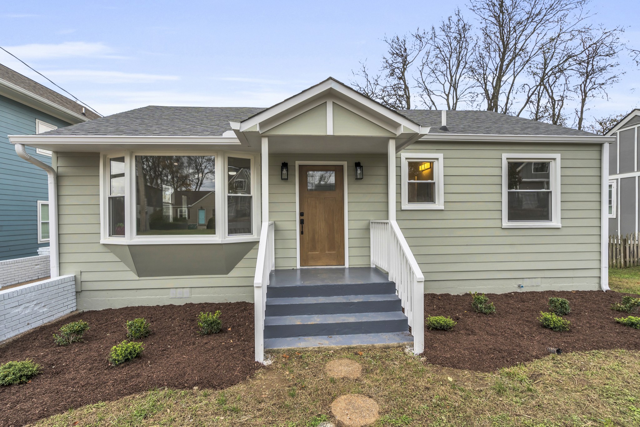 a front view of a house with a porch