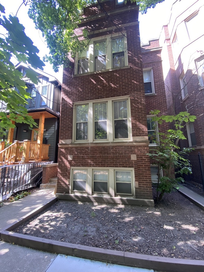 a brick building with a large windows