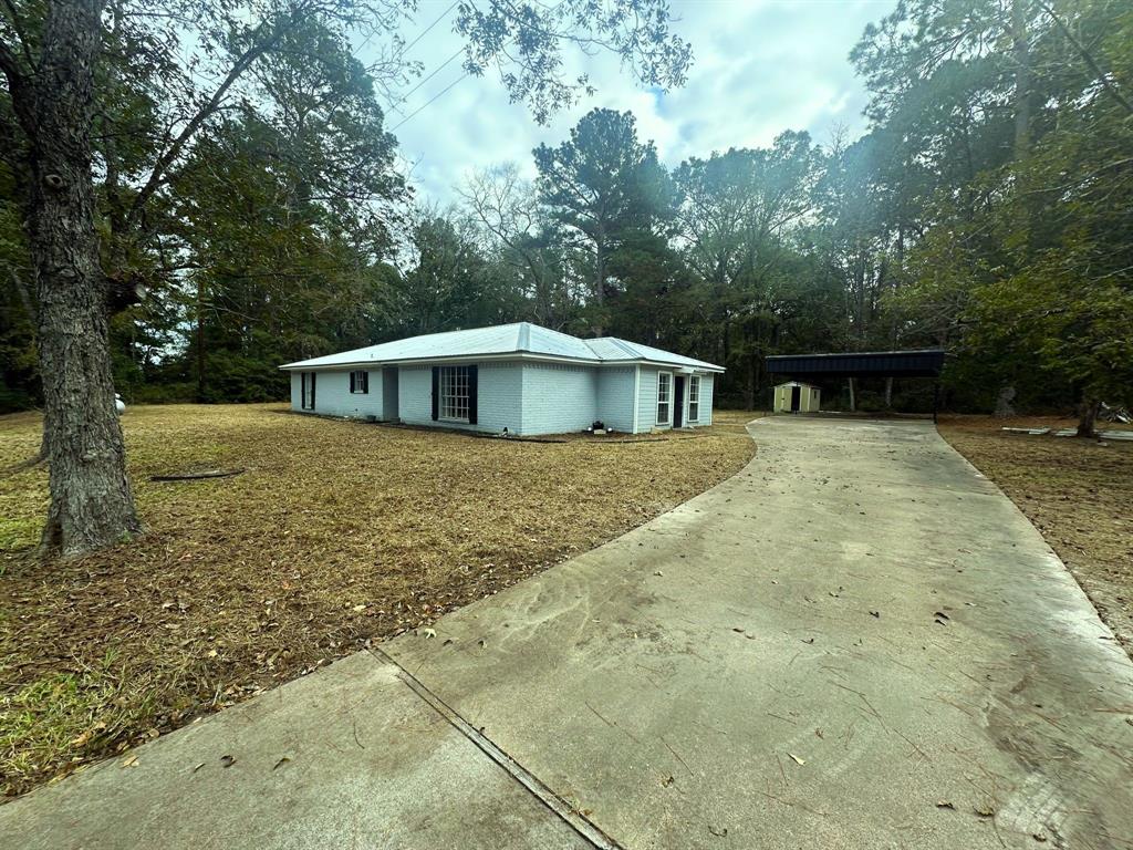 a house with trees in the background