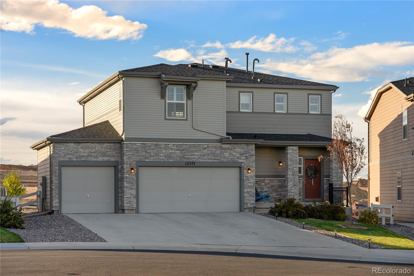 a front view of a house with garage