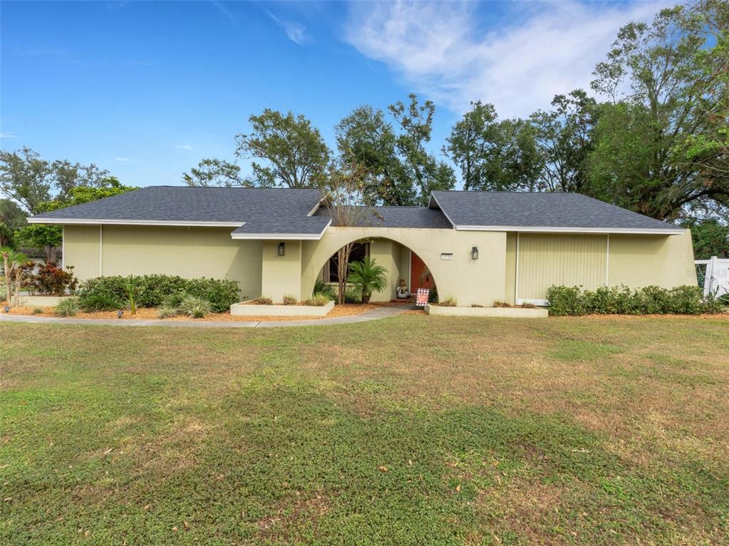 a front view of a house with garden