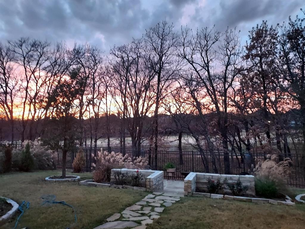 a view of backyard with outdoor seating and green space