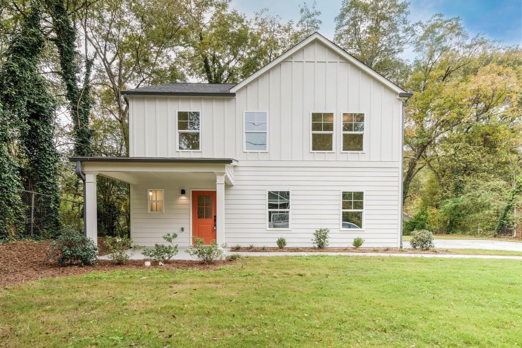 a front view of a house with a yard