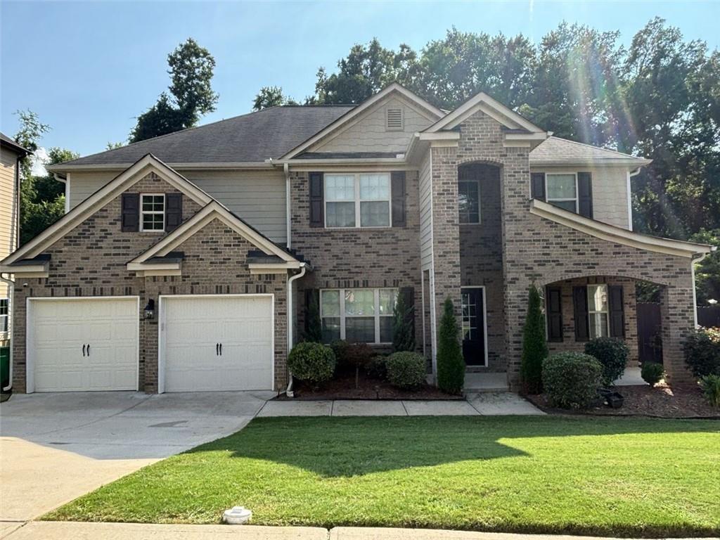 a view of a yard in front view of a house