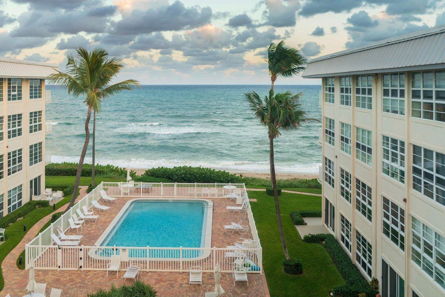 a view of a swimming pool with a yard