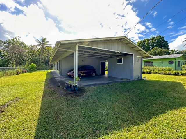 a view of a house with backyard porch and furniture