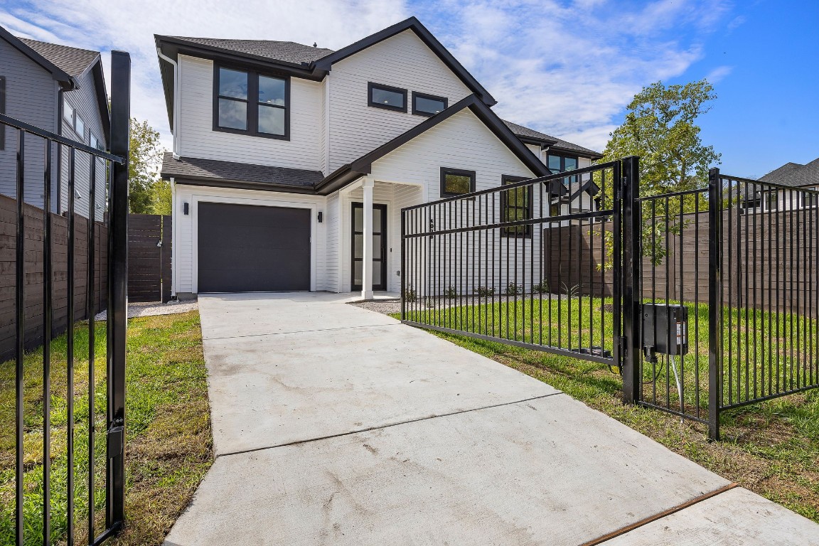 a view of a wrought iron fences in front of house