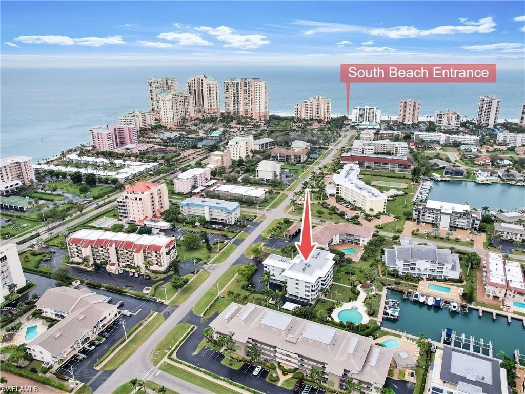 Birds eye view of property with a water view