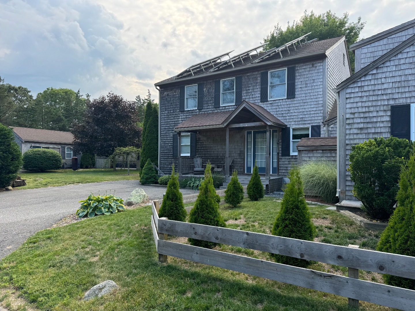 a front view of a house with garden