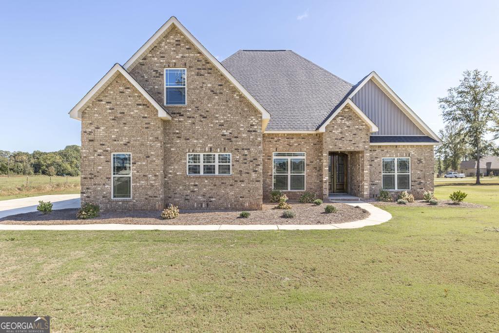 a front view of a house with swimming pool and porch