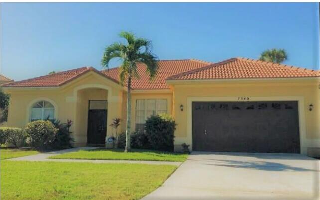 a front view of a house with a garage