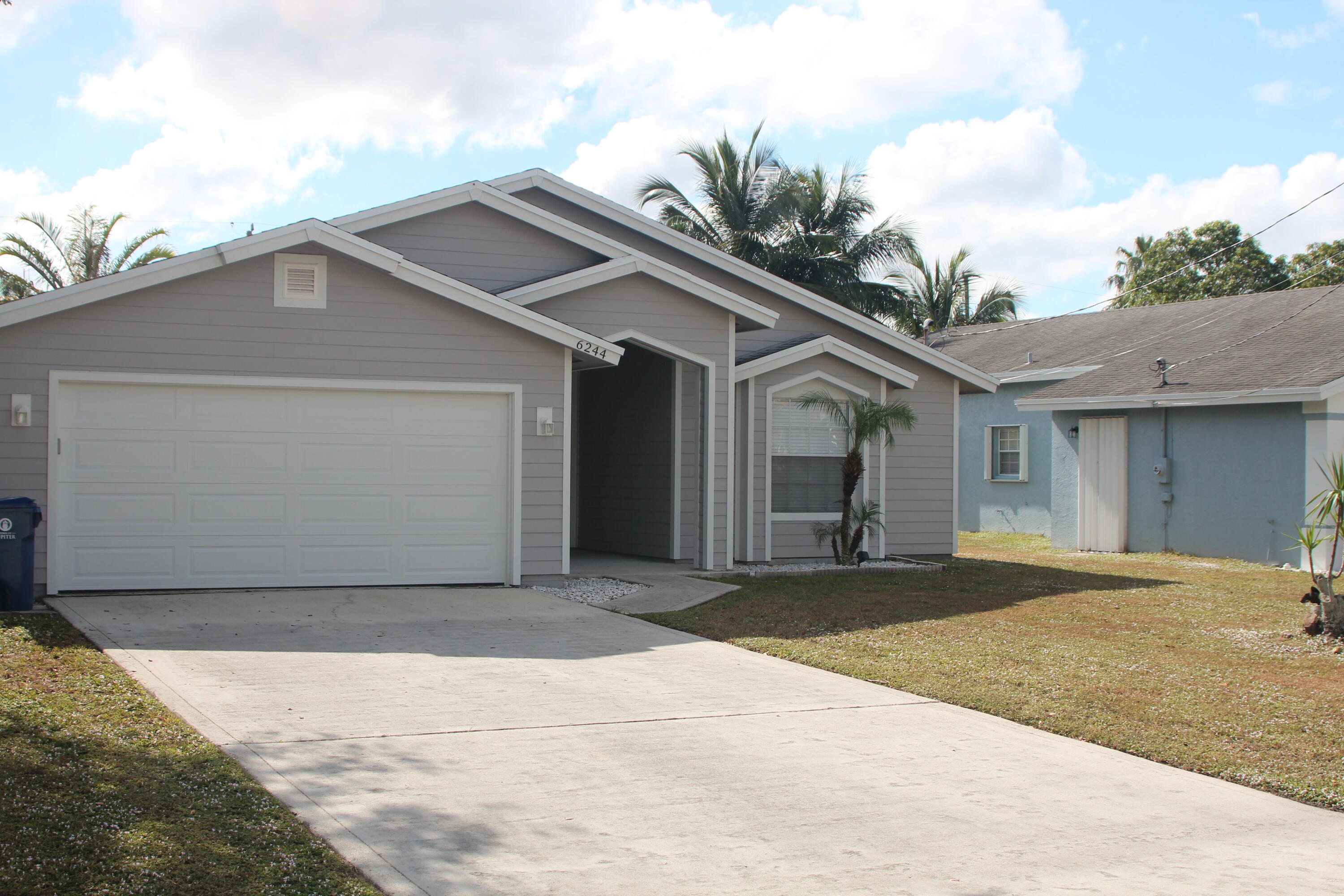 a front view of a house with a garage